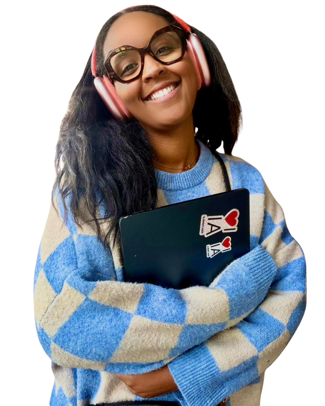 Erin smiling in glasses and pink headphones, holding a laptop