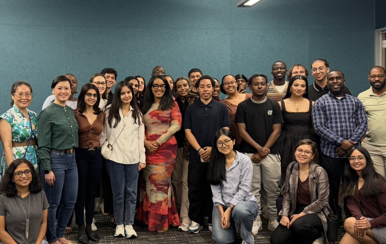 Erin with a group of attendees after a speaking engagement